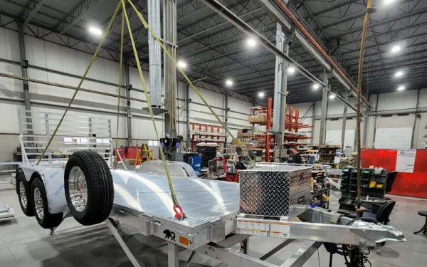 silver trailer hanging in a warehouse