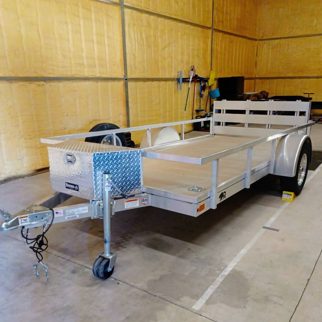 trailer with side rails parked in a warehouse